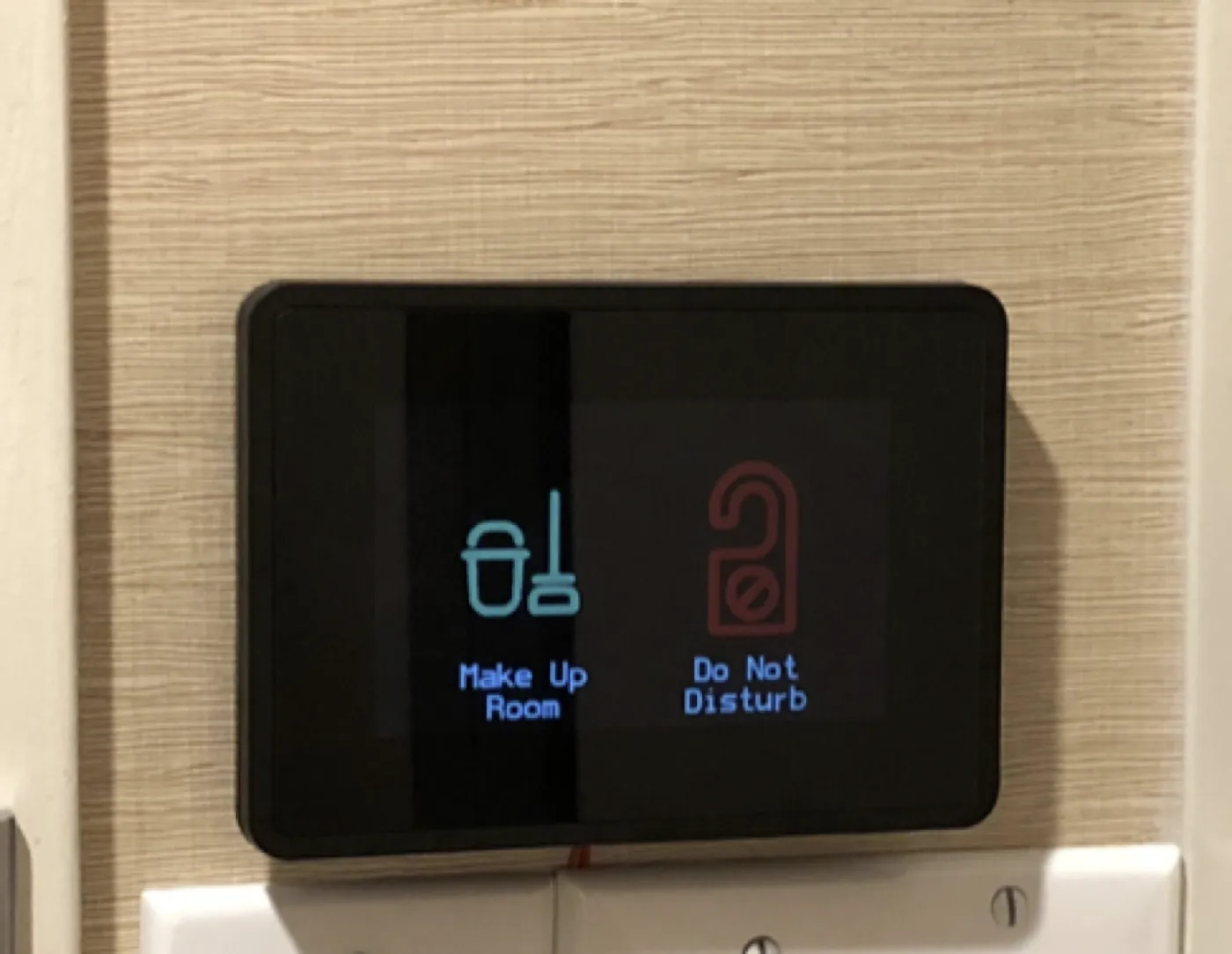 Interior GridRabbit DnD and MuR touch screen installed by a room door