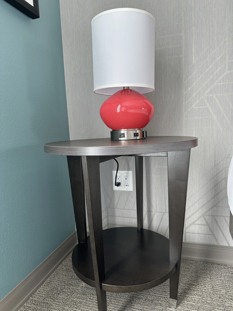 GridRabbit-compatible smart outlet installed near a hotel bed