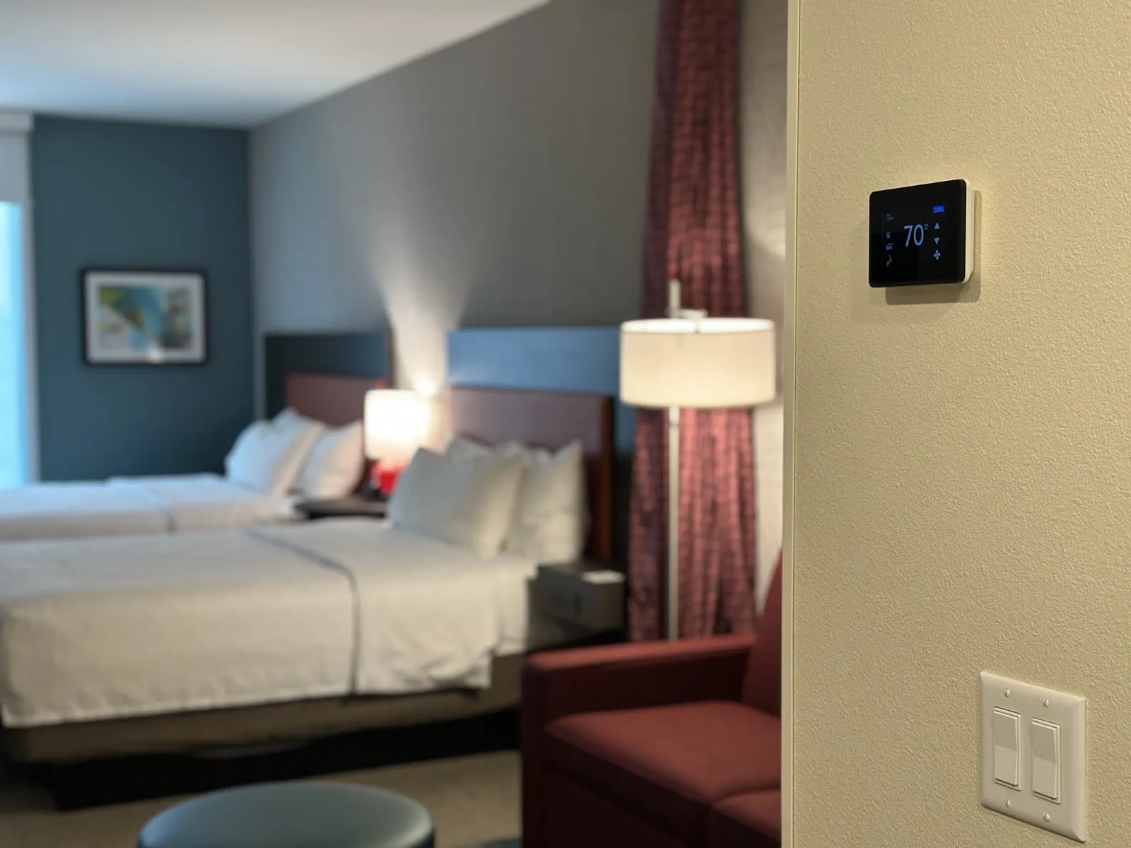 GridRabbit-compatible thermostat and switch controls installed in a guest room
