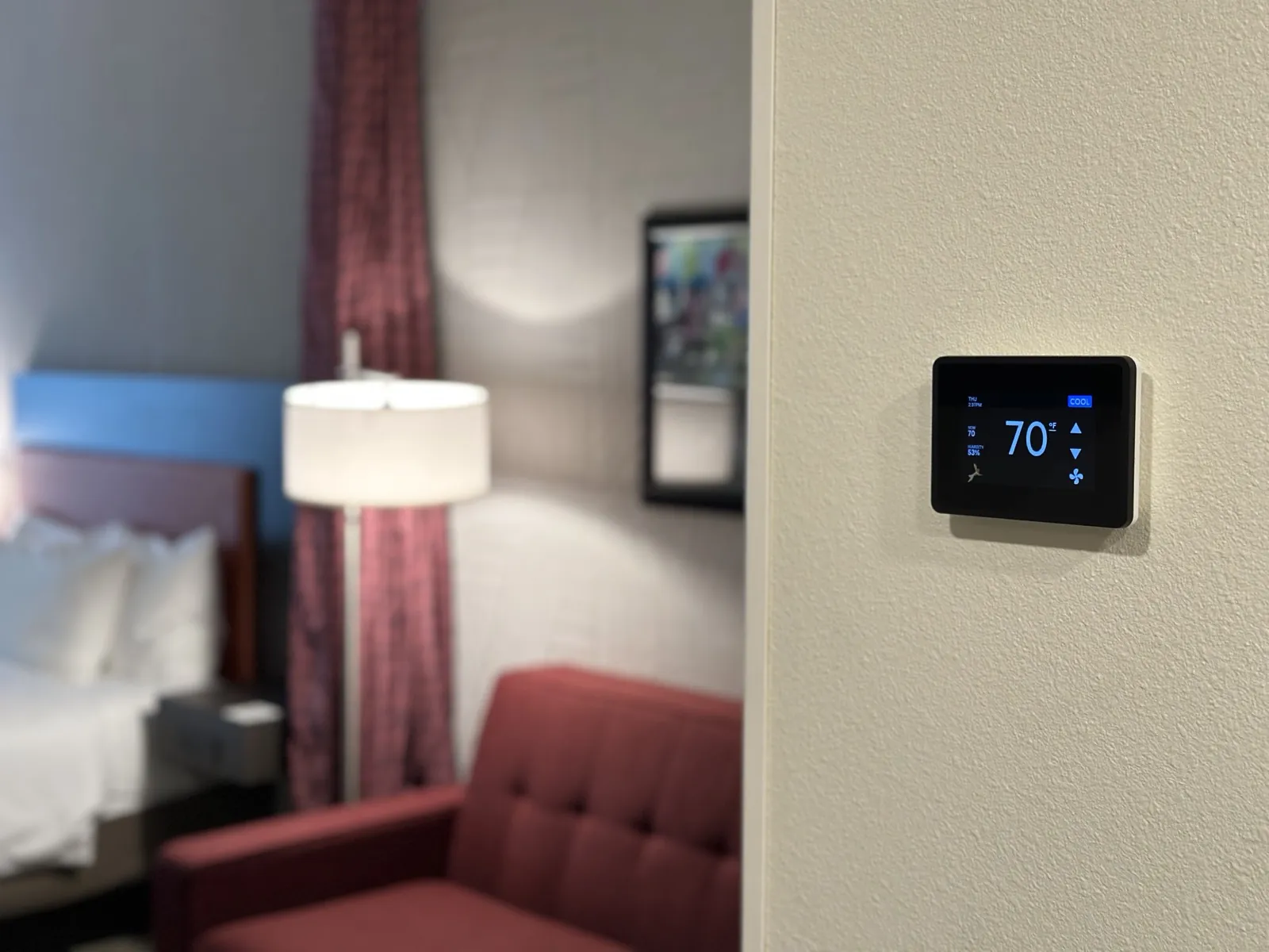 GridRabbit smart thermostat installed in a guest room